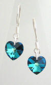 Pair of heart shaped Bermuda Blue Swarovski earrings on sterling silver earwires.