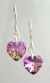 Pair of heart shaped Light Vitrial Swarovski earrings on sterling silver earwires.