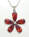 5 petalled daisy shape pendant in Amber coloured facetted Cubic Zirconia.