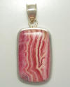 Rounded rectangular pendant in Rhodocroisite.