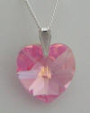Rose heart shaped pendant on sterling silver bail and chain.