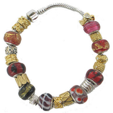 Sterling silver bracelet with Chrysalis glass, silver and gold plated silver spacer beads.