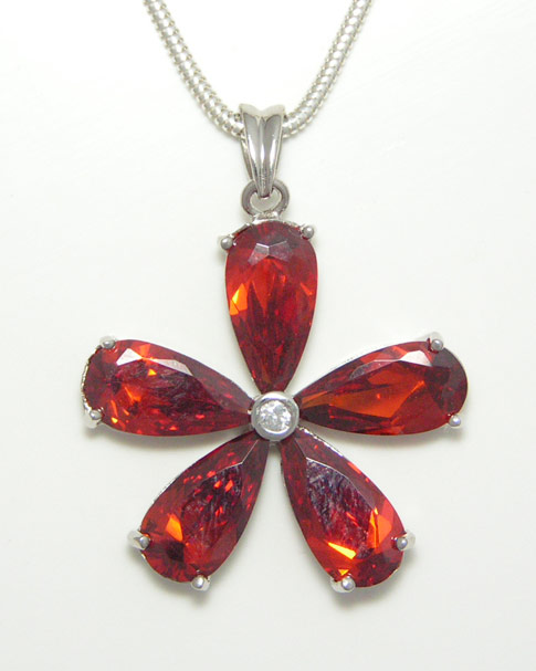 Flower shaped pendant made up of 5 cut Cubic Zirconia.